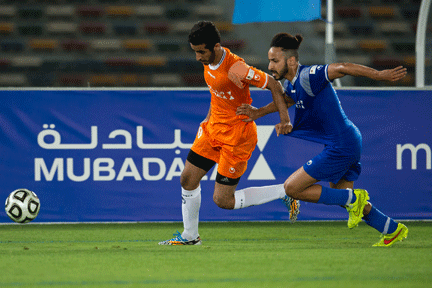 2-players-competing-for-possession-at--mubadala-football-tournament-2015_432_288