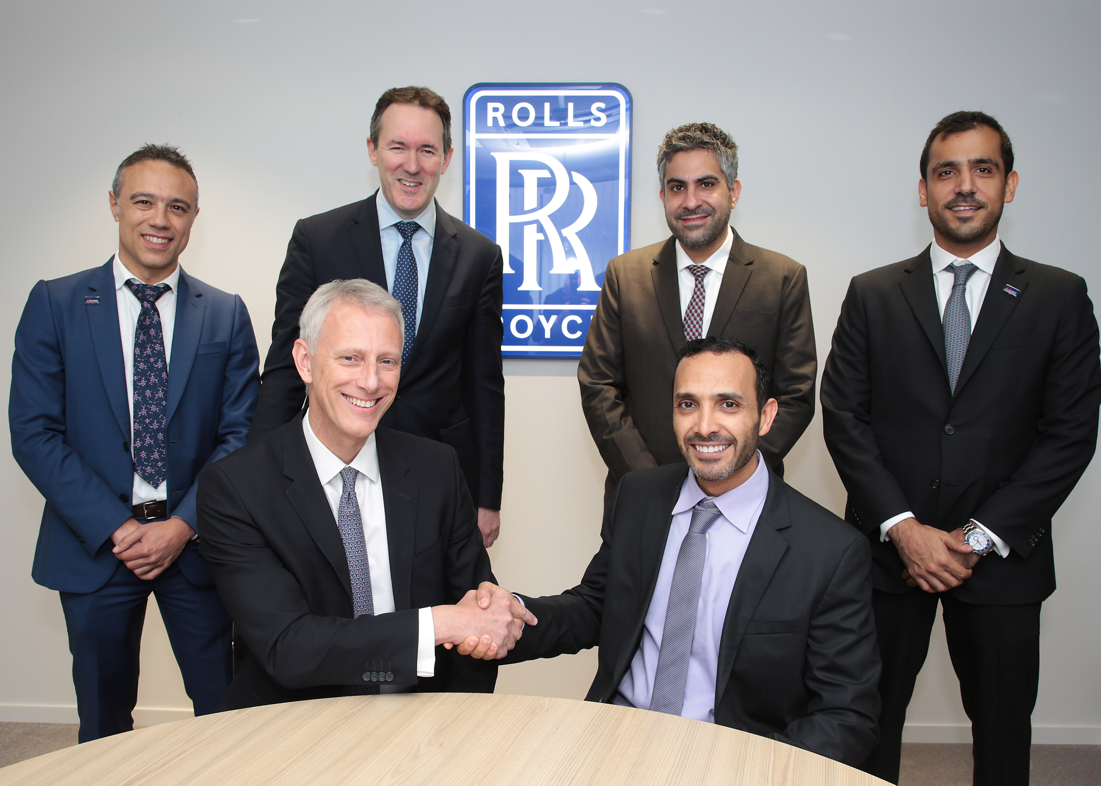 signing--khaled-al-qubaisi-ceo-aerospace-renewables--ict-mubadala-and-chris-cholerton-rolls-royce